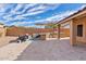 Paver patio with built-in BBQ, outdoor kitchen, and comfortable seating for entertaining in the backyard at 4514 E Mazatzal Dr, Cave Creek, AZ 85331