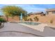 Private backyard pool featuring a spacious patio area with desert landscaping and an umbrella for shade at 4514 E Mazatzal Dr, Cave Creek, AZ 85331