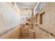 The bathroom's shower showcases beautiful tile work, a built-in bench, and recessed shelving at 4514 E Mazatzal Dr, Cave Creek, AZ 85331