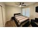 Neutral bedroom with a ceiling fan, a comfortable bed, and a bedside table at 4925 E Desert Cove Ave # 117, Scottsdale, AZ 85254