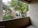 View from the patio with trees and foliage with a partial view of other buildings at 4925 E Desert Cove Ave # 117, Scottsdale, AZ 85254