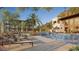 Luxurious pool area with lounge chairs and lush landscaping, set against a desert backdrop at 5000 N Camelback Ridge Dr # 304, Scottsdale, AZ 85251