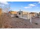 View of the exterior of the mobile home in a community with gravel landscaping and a shed at 535 S Alma School Rd # 60, Mesa, AZ 85210