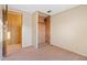 A bedroom featuring a closet with a wood accent wall at 535 S Alma School Rd # 60, Mesa, AZ 85210