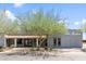 Front view of the Alma Meadows building featuring southwestern-style architecture and lush landscaping at 535 S Alma School Rd # 60, Mesa, AZ 85210