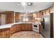 Well-lit kitchen featuring modern appliances, lots of counter space, and tile backsplash at 535 S Alma School Rd # 60, Mesa, AZ 85210