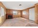 Inviting living room featuring a decorative fireplace and neutral carpet at 535 S Alma School Rd # 60, Mesa, AZ 85210