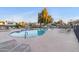 Relaxing community pool area featuring lounge chairs, seating, and a mature shade tree at 535 S Alma School Rd # 60, Mesa, AZ 85210