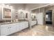 Well-lit bathroom with dual sinks, granite countertop, and a large mirror at 6442 W Cavedale Dr, Phoenix, AZ 85083