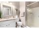 Bright bathroom featuring a walk-in glass shower and granite countertop vanity at 6442 W Cavedale Dr, Phoenix, AZ 85083