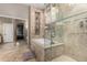 Elegant bathroom with glass enclosed shower and separate soaking tub at 6442 W Cavedale Dr, Phoenix, AZ 85083