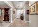 Inviting foyer with tile floors, decorative accents, and a view into the formal dining room at 6442 W Cavedale Dr, Phoenix, AZ 85083