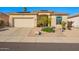 Charming single-story home featuring a desert landscape, solar panels, and a neutral-toned facade at 6442 W Cavedale Dr, Phoenix, AZ 85083