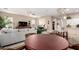 Open-concept living room with a view of the kitchen and adjacent dining area at 6442 W Cavedale Dr, Phoenix, AZ 85083