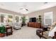 Bright and airy living room with neutral tones, plush carpet, and a ceiling fan at 6442 W Cavedale Dr, Phoenix, AZ 85083