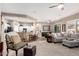 Open-concept living room featuring a breakfast bar, modern furniture, and neutral decor at 6442 W Cavedale Dr, Phoenix, AZ 85083