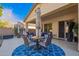 Inviting covered patio with a dining set, perfect for outdoor entertaining at 6442 W Cavedale Dr, Phoenix, AZ 85083