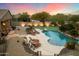 Backyard oasis with a pool, putting green, and multiple lounge areas for ultimate relaxation at 6626 E Oberlin Way, Scottsdale, AZ 85266