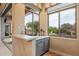 Entertainers wet bar with granite counters and backyard views at 6626 E Oberlin Way, Scottsdale, AZ 85266