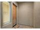 Entryway with a solid wood door, 'hello' welcome mat, neutral walls and tile flooring at 6626 E Oberlin Way, Scottsdale, AZ 85266