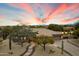 Stunning desert home with stone accents, mature trees, and a winding pathway leading to the grand entrance at 6626 E Oberlin Way, Scottsdale, AZ 85266