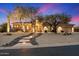 Beautiful front yard with illuminated stone walkway and desert landscaping at 6626 E Oberlin Way, Scottsdale, AZ 85266