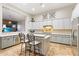 Modern kitchen with stainless steel appliances, large island and breakfast bar at 6626 E Oberlin Way, Scottsdale, AZ 85266