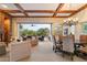 Inviting living room with wood beam ceiling, stone fireplace and seamless indoor/outdoor living at 6626 E Oberlin Way, Scottsdale, AZ 85266