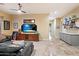 The living room has tile floors, a TV, a cabinet, and a leather sofa at 6626 E Oberlin Way, Scottsdale, AZ 85266