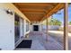 Covered patio overlooking a spacious backyard with a storage shed, perfect for outdoor living at 6934 E Coronado Rd, Scottsdale, AZ 85257