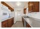 This kitchen features sleek cabinets and modern appliances, including a stainless steel dishwasher at 6934 E Coronado Rd, Scottsdale, AZ 85257