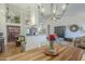 Charming dining area showcasing hardwood floors and seamless access to the kitchen and living room at 7149 E Quartz St, Mesa, AZ 85207