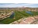 Aerial view of a lush golf course, complete with scenic lakes and upscale homes at 7149 E Quartz St, Mesa, AZ 85207