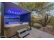 Hot tub under a cabana with an outdoor shower and landscaping at 7149 E Quartz St, Mesa, AZ 85207