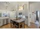 Bright kitchen featuring stainless steel appliances, gray cabinets, and hardwood flooring at 7149 E Quartz St, Mesa, AZ 85207