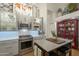 This bright kitchen features stainless steel appliances, gray cabinets and a center island with seating at 7149 E Quartz St, Mesa, AZ 85207