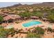 Aerial view of community pool with lounge chairs and desert landscaping at 7149 E Quartz St, Mesa, AZ 85207