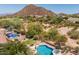 Aerial view of private backyard featuring swimming pool, hot tub, and mountain view at 7149 E Quartz St, Mesa, AZ 85207