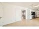 Open living space with white brick accents and tile flooring, leading to the kitchen and front door at 726 N 78Th St, Scottsdale, AZ 85257