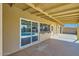 Covered patio featuring tiled floors and sliding glass doors with a view of the pool at 726 N 78Th St, Scottsdale, AZ 85257