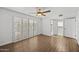 Bedroom featuring tile floors, a ceiling fan, shuttered windows and closet access at 7401 E Northland Dr # 1, Scottsdale, AZ 85251