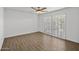 Bedroom featuring tile floors, a ceiling fan, and shuttered windows at 7401 E Northland Dr # 1, Scottsdale, AZ 85251