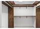 Wood closet with shelves and racks at 7401 E Northland Dr # 1, Scottsdale, AZ 85251