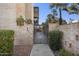 Charming gated entrance to home, with brick accents and desert landscaping at 7401 E Northland Dr # 1, Scottsdale, AZ 85251