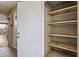 Functional storage area with built-in shelving and secure door for storing items and keeping them neatly organized at 7401 E Northland Dr # 1, Scottsdale, AZ 85251