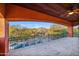 Covered patio offering views of the pool, desert landscaping, and mountains at 7500 E Roy Rogers Rd, Scottsdale, AZ 85266