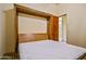 Bedroom featuring a Murphy bed and a closet at 7500 E Roy Rogers Rd, Scottsdale, AZ 85266