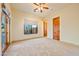 Bedroom with large windows providing natural light and tiled floors at 7500 E Roy Rogers Rd, Scottsdale, AZ 85266