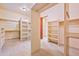 Spacious walk-in closet with custom shelving and ample storage at 7500 E Roy Rogers Rd, Scottsdale, AZ 85266