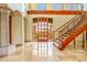 A grand foyer with marble flooring, staircase, and custom entryway at 7500 E Roy Rogers Rd, Scottsdale, AZ 85266